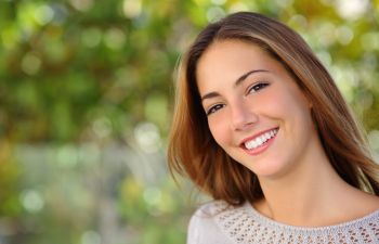 Happily smiling young woman.