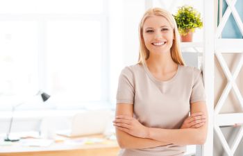 Happily smiling young woman.